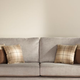 Illustration for article titled Empty Wall Behind Couch Falls Into Girlfriend’s Crosshairs